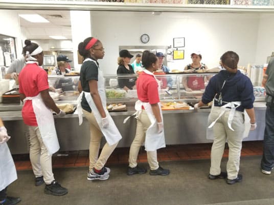 Students working the soup kitchen